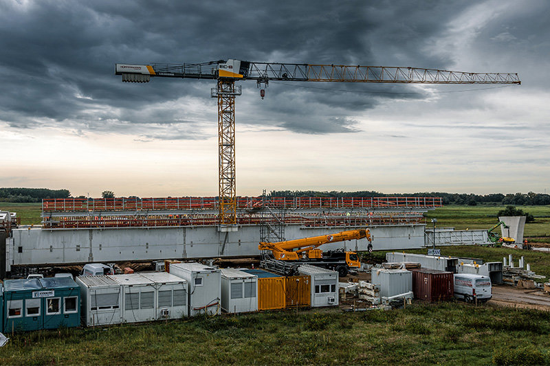 Liebherr tower crane works on unusual bridge construction